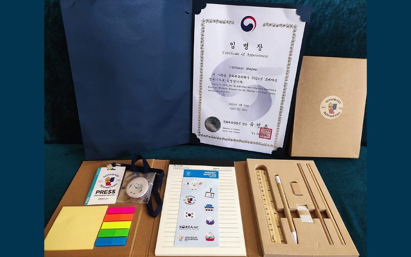  appointment certificate as an Honorary Reporter for Korea net for the year 2024, along with the set of stationery  and the Honorary Reporter identification card (Shaymaa Gamal)